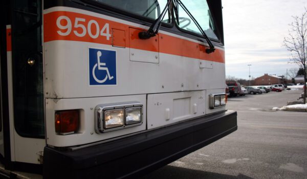 Front of public bus showing the International Symbol of Accessibility.