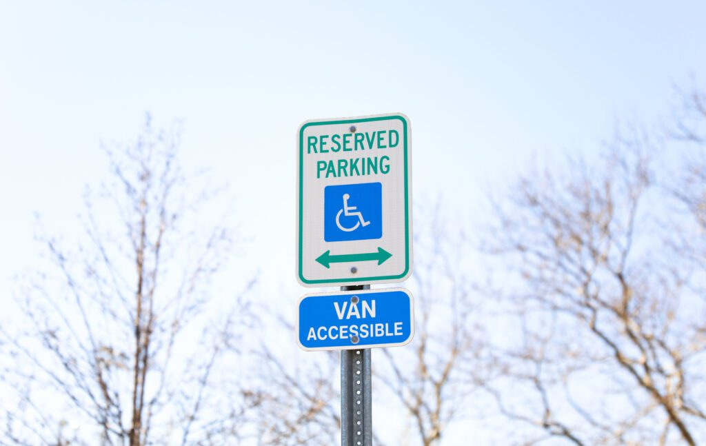 The Handicap Sign Is A Blue And White Symbol Of Accessibility. It Represents The Need For Barrier Free Access For Individuals With Disabilities, Ensuring Their Equal Participation In Society.